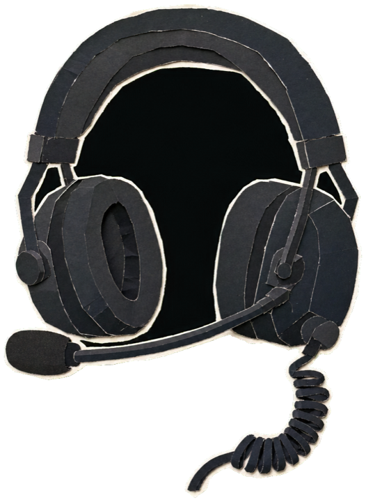 a race engineer's pit-wall headset, black over-ear headphones with a slim boom microphone and a coiled cable