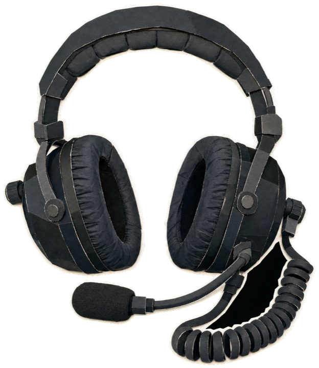 a black F1 pit-wall headset with boom microphone, padded ear cups and coiled cable, single object cut-out