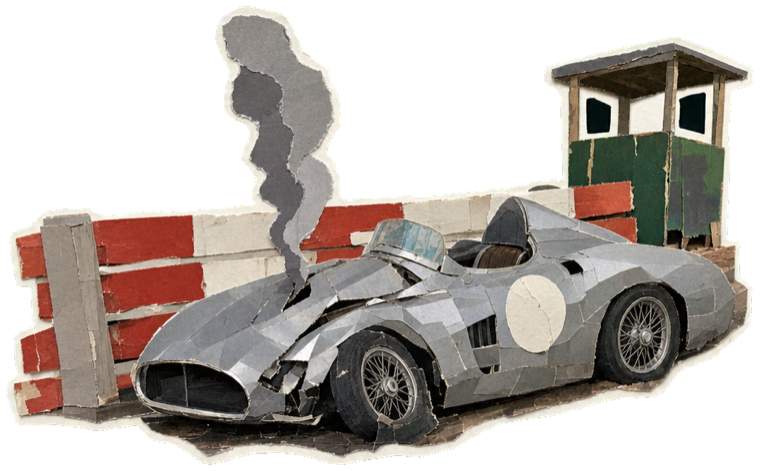 A broken-down silver car beside the barriers
